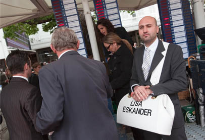 Bookie’s assistant Terry Vitanopoulos and punters in the betting ring at Flemington, 2010