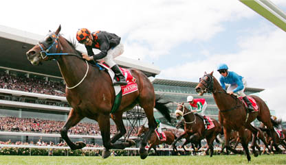 Jockey Corey Brown leads the field in the 2009 Melbourne Cup